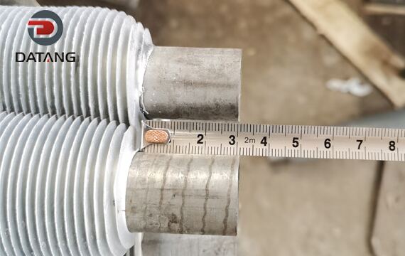 Extruded fin tube detection of reserved length at both ends