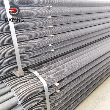 Serrated finned tubes for nuclear power plant heat exchangers